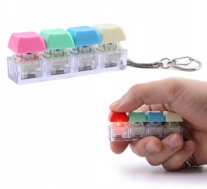 BRELOK KLIKACZ ANTYSTRESOWY KOSTKA 4W1 ZABAWKA FIDGET ŚWIECĄCY LED PREZENT